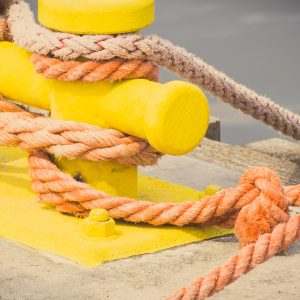 Vintage photo, Rope and mooring bollard in port, parts and detail of seaport